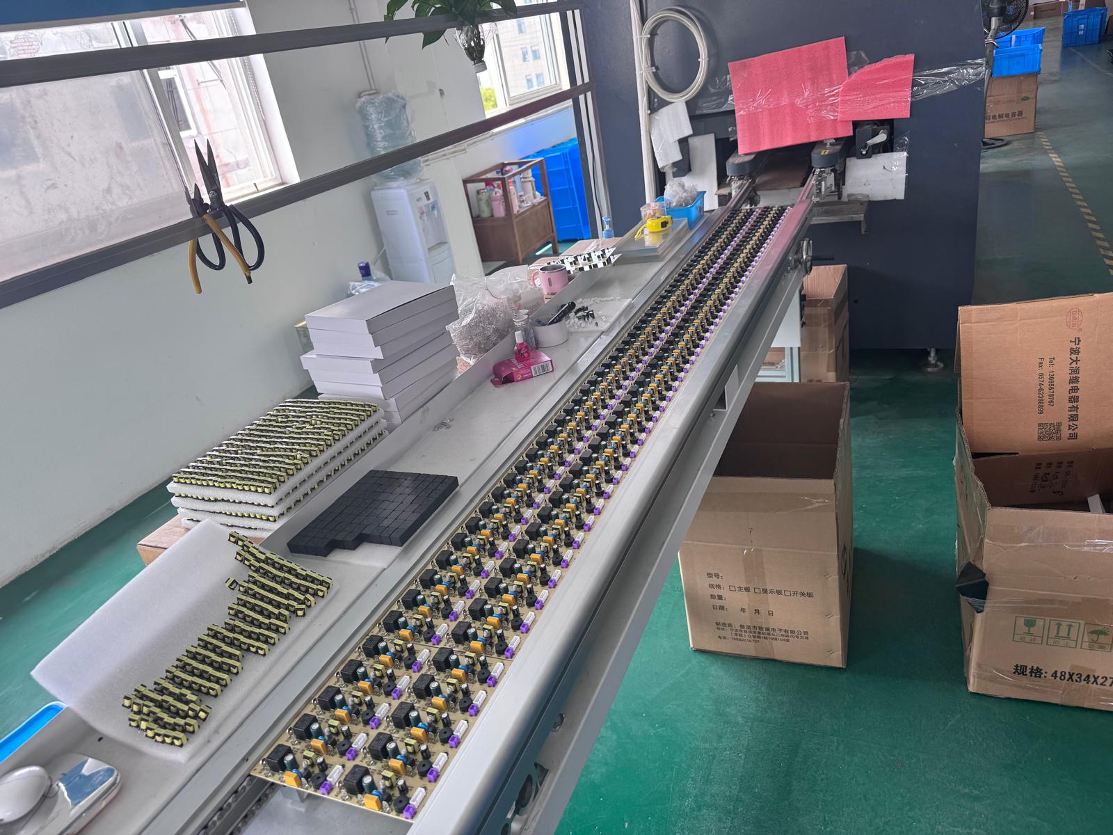 Circuit boards moving along an assembly line at the Labesera manufacturing partner's factory in China